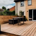 exterior-back-garden-patio-area-with-wood-decking-generative-ai_batcheditor_fotor